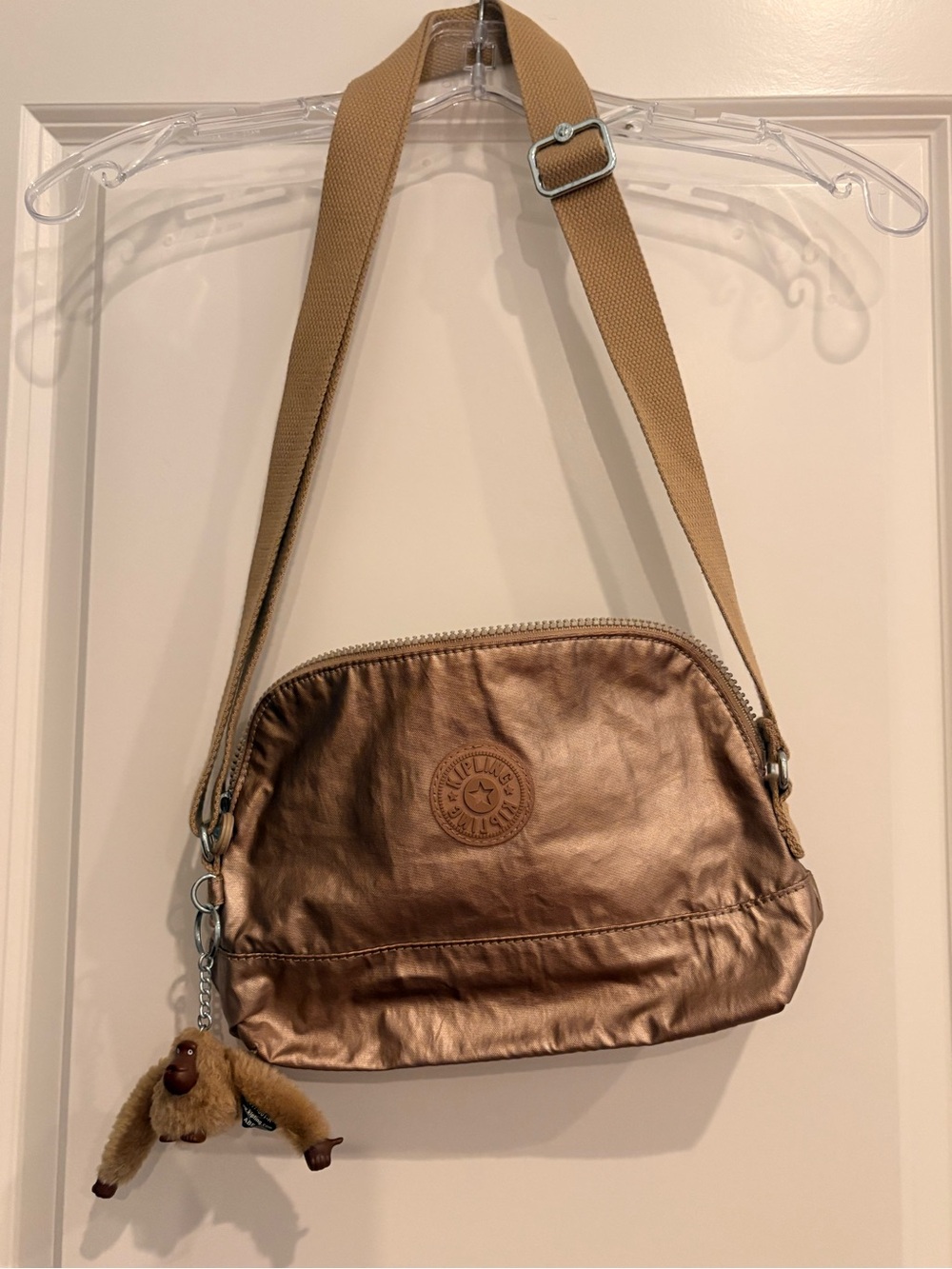 Kipling Metallic Bronze Crossbody with Adjustable Tan Strap and Monkey Charm